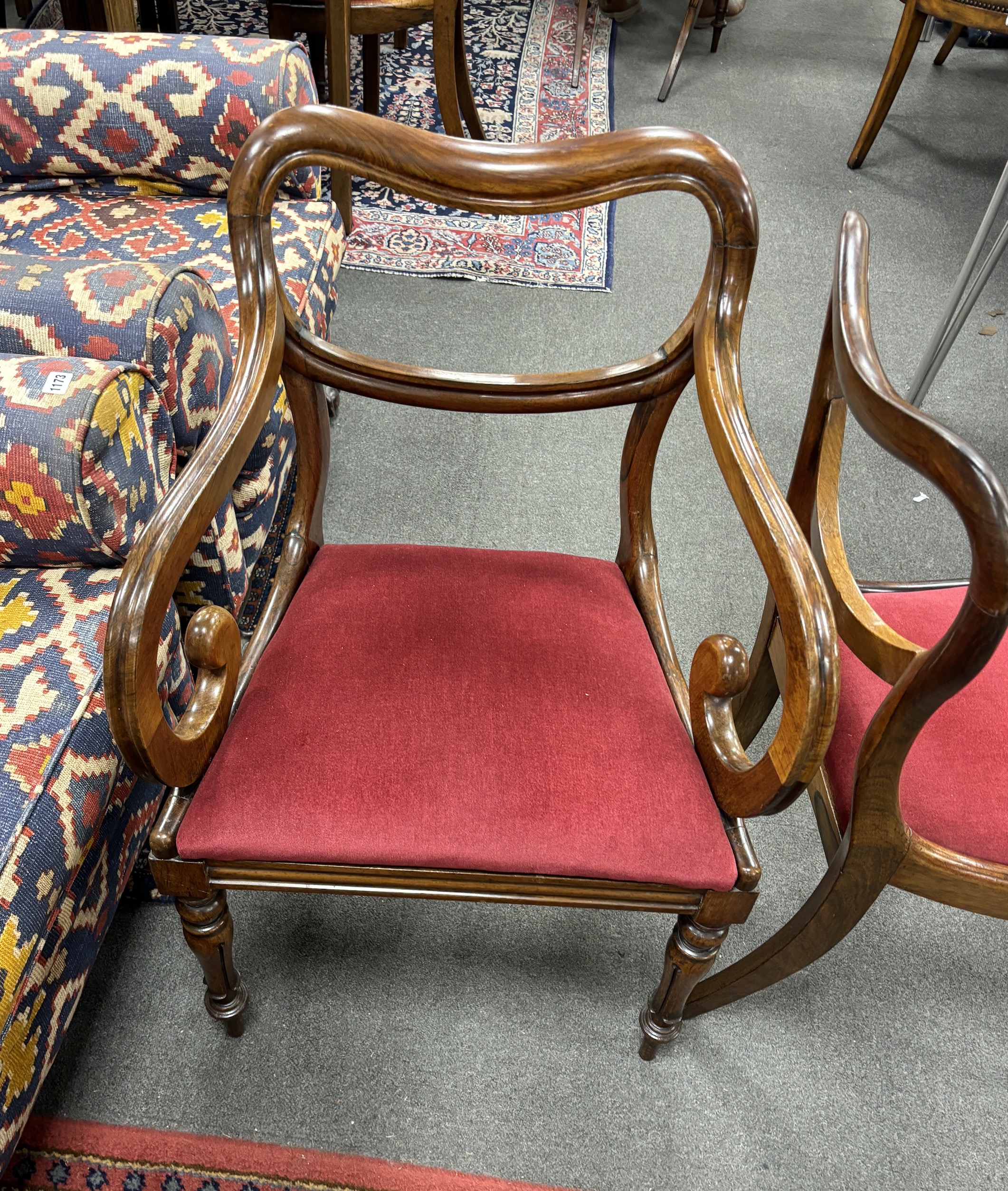 A set of six early Victorian rosewood dining chairs, two with arms